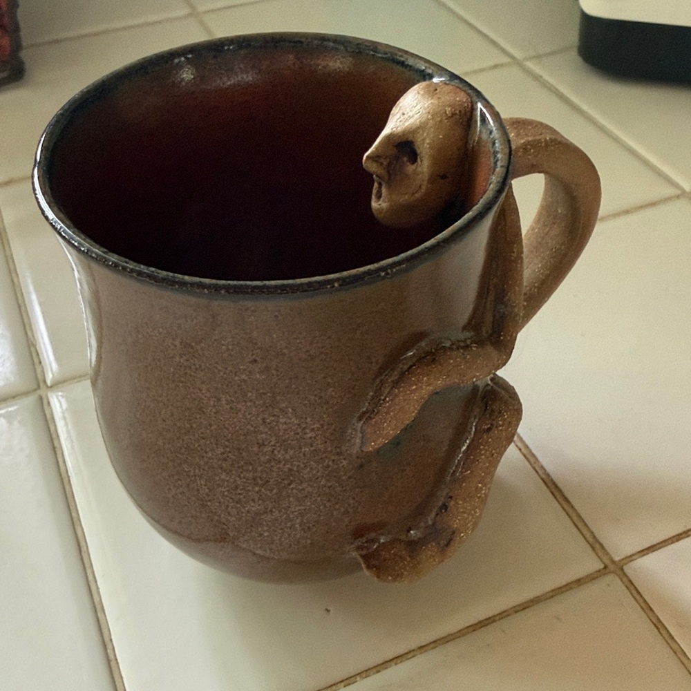 Brown Ceramic scary face folk-art mug with body handle